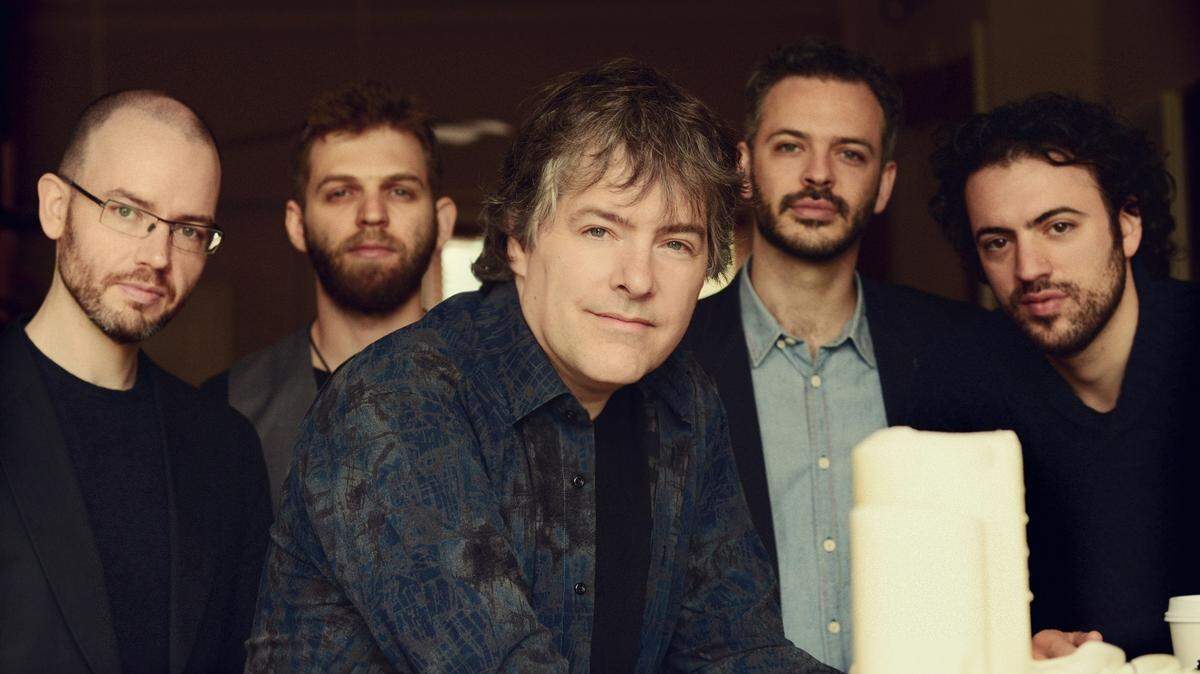 Banjo great Béla Fleck, center, teams with string quartet Brooklyn Rider — Nicholas Cords, left, Johnny Gandelsman, Colin Jacobsen, Eric Jacobsen — for its latest tour.