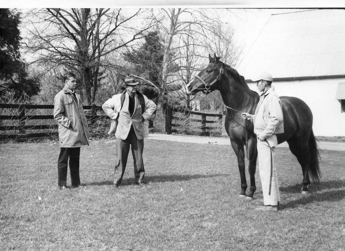 Arthur Hancock III and his father Arthur “Bull” Hancock inspect a horse at Claiborne Farm.