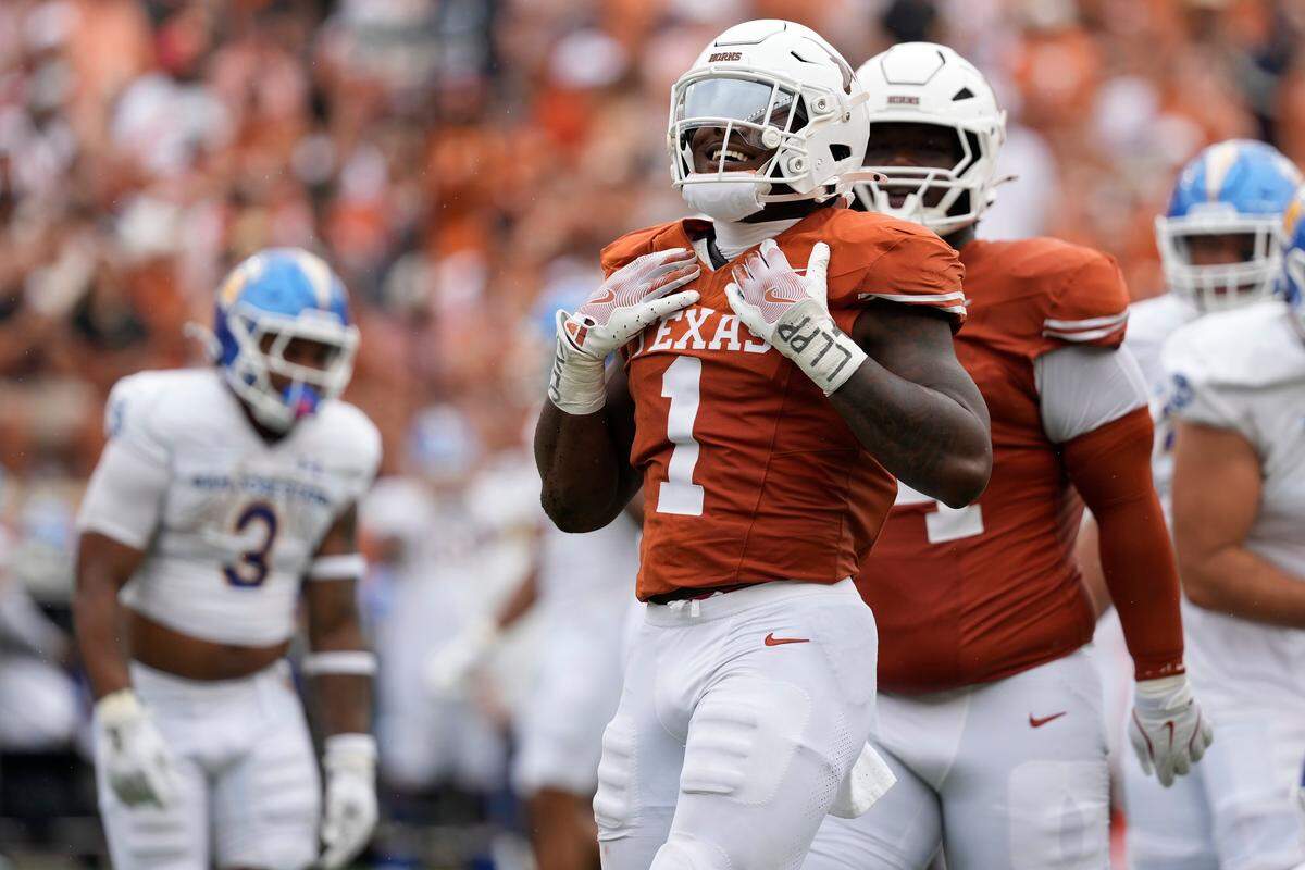 Texas rush end Colin Simmons (1) has four quarterback sacks so far this season and has 13 in his career.
