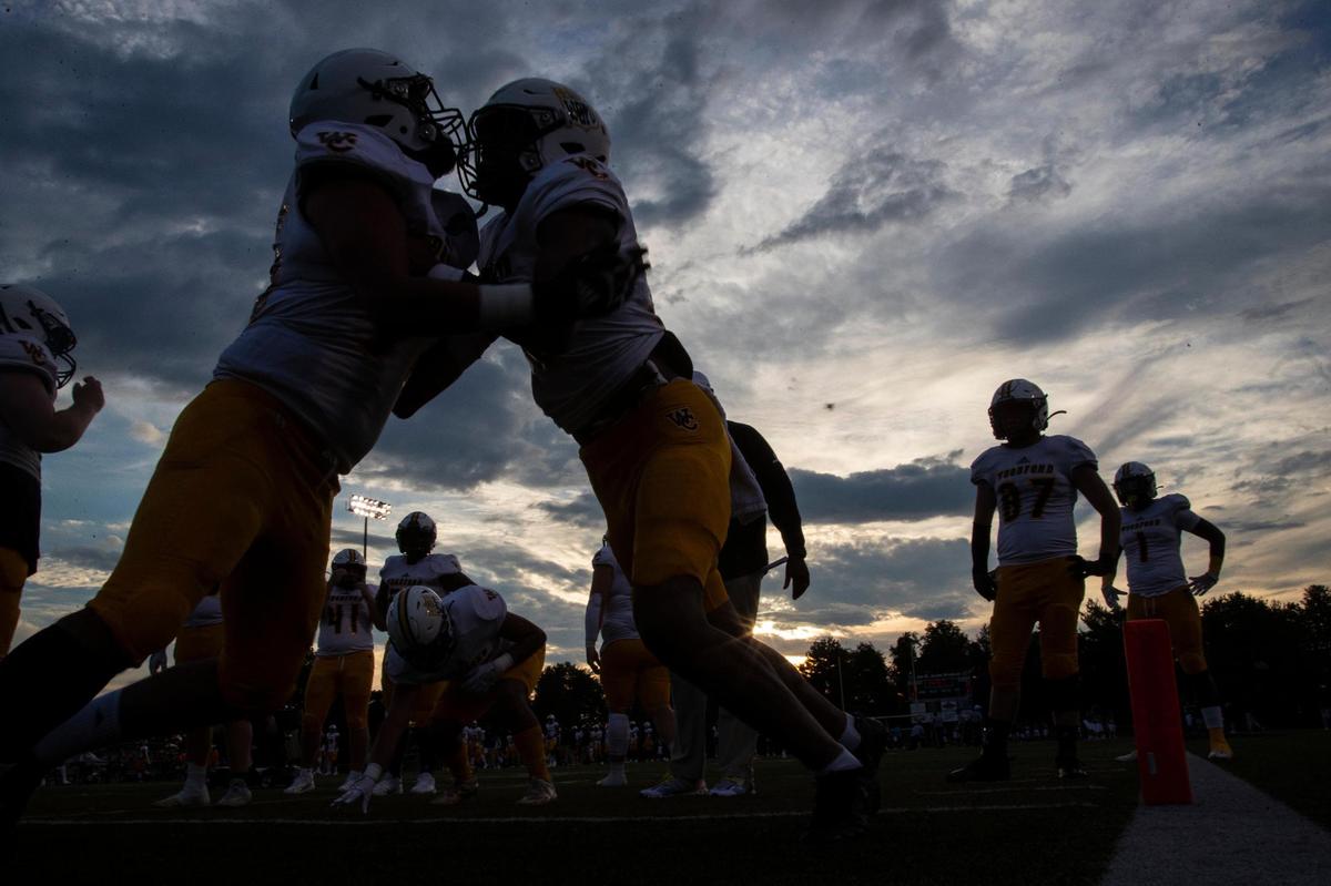The Woodford County Yellow Jackets warm up before facing the Paul Laurence Dunbar Bulldogs during the game at Paul Laurence Dunbar High School in Lexington, Ky., Friday, September 2, 2022.