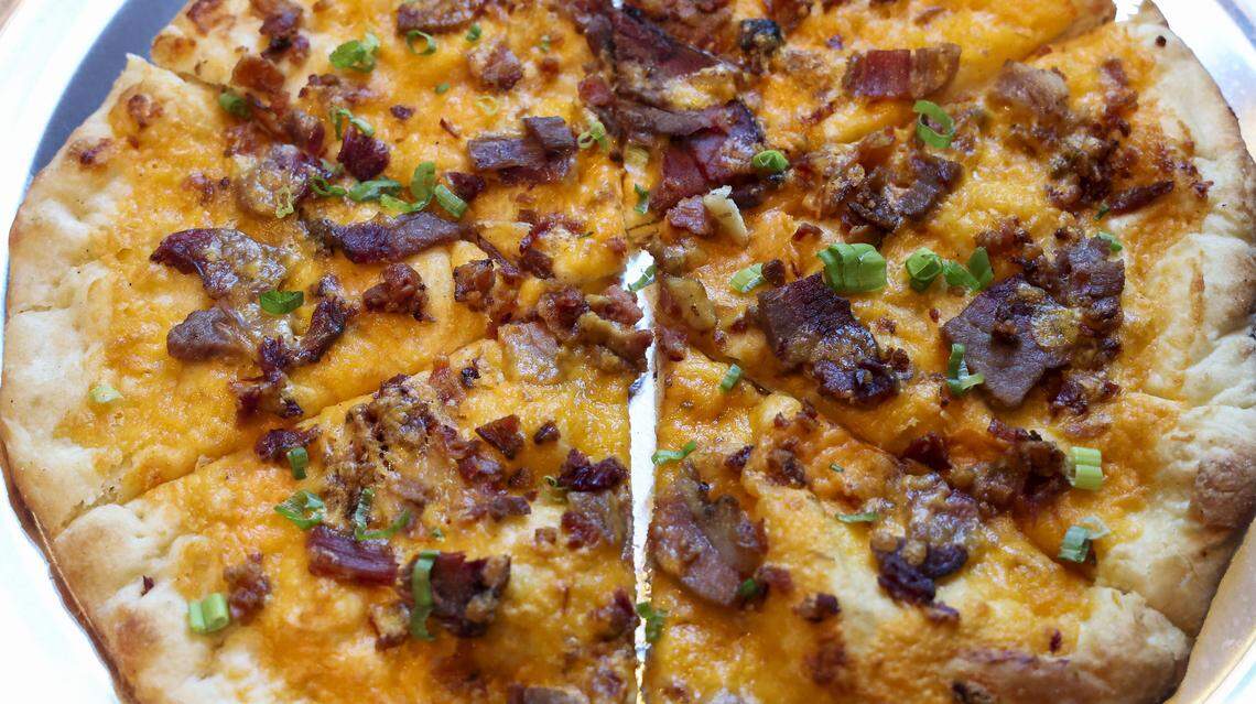 Southern Cookhouse & Bar has four pizzas on the menu including the Boone ($18.95), photographed Sunday, Sept.  7, in Lexington, Ky. It’s made with homemade beer cheese, brisket and applewood bacon. 