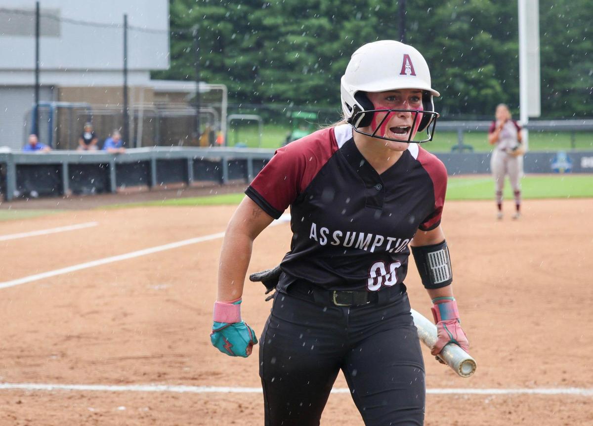 Assumption’s Lauren Satterly reacts after scoring a run in the third inning against Henderson County in the state softball finals Saturday.