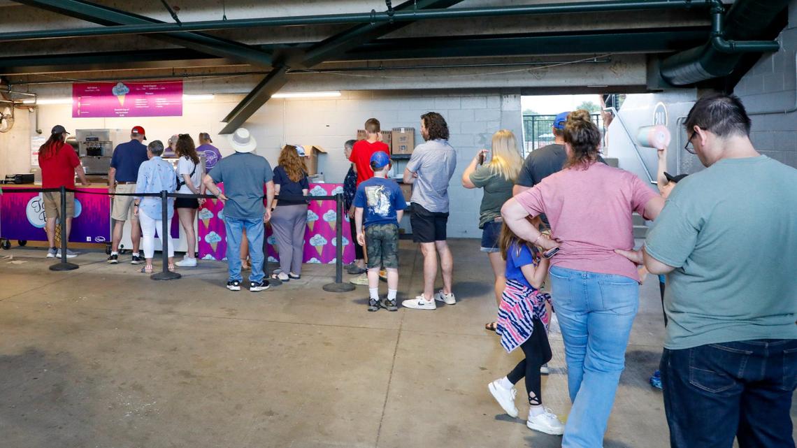 Customers wait in line to get ice cream from a Taylor Belle’s stand during a Lexington Legends baseball game May 25, 2024 at Legends Field in Lexington, Ky.