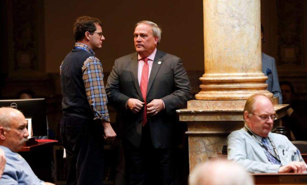 Herald-Leader reporter John Cheves listens to Kentucky Senate President Robert Stivers, R-Manchester, in the Senate chamber at the Capitol.