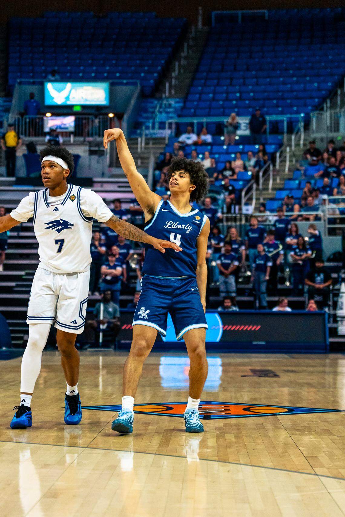 Liberty sophomore guard Brett Decker Jr. holds his follow through after making a shot against Nevada during the second round of the NIT on March 21, 2026, at the Lawlor Events Center in Reno, Nevada.