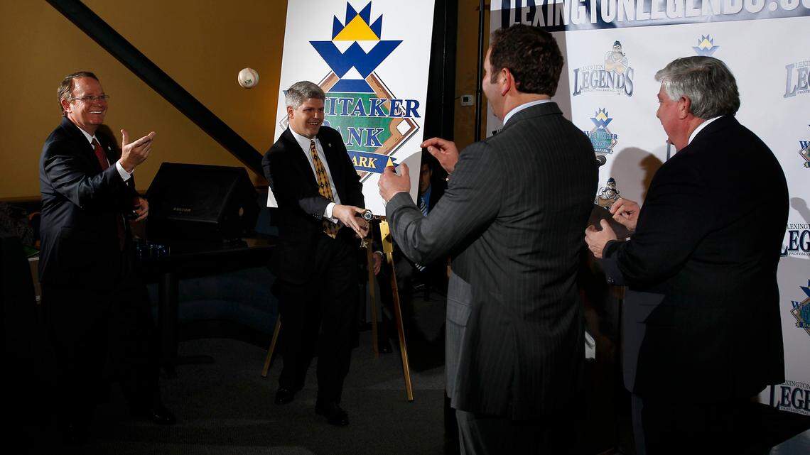 Whitaker Bank president Tom Hinkebein, left, and CEO  Elmer Whitaker,  second from left, tossed ceremonial pitches to  Legends COO Alan Stein, right, and general manager Andy Shea during Thursday's announcement of the ballpark's new name.         
