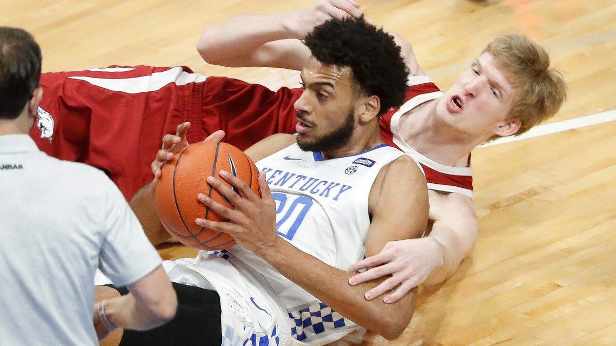 Kentucky forward Olivier Sarr (30) battled for the ball with Arkansas forward Connor Vanover (23) during their game in Rupp Arena on Feb. 9.