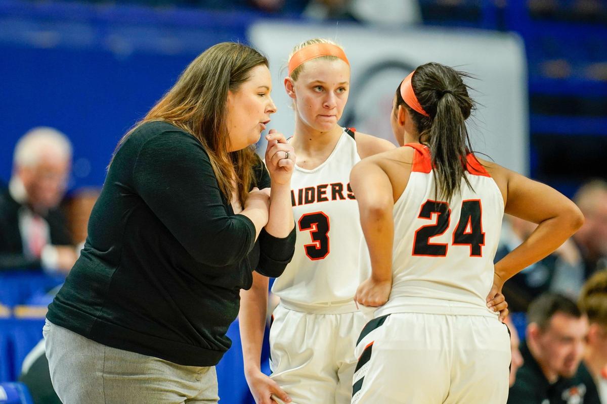Ryle head coach Katie Haitz talked with Brie Crittendon (3) and Jaiden Douthit (24) during the defending state champions’ win Wednesday afternoon.