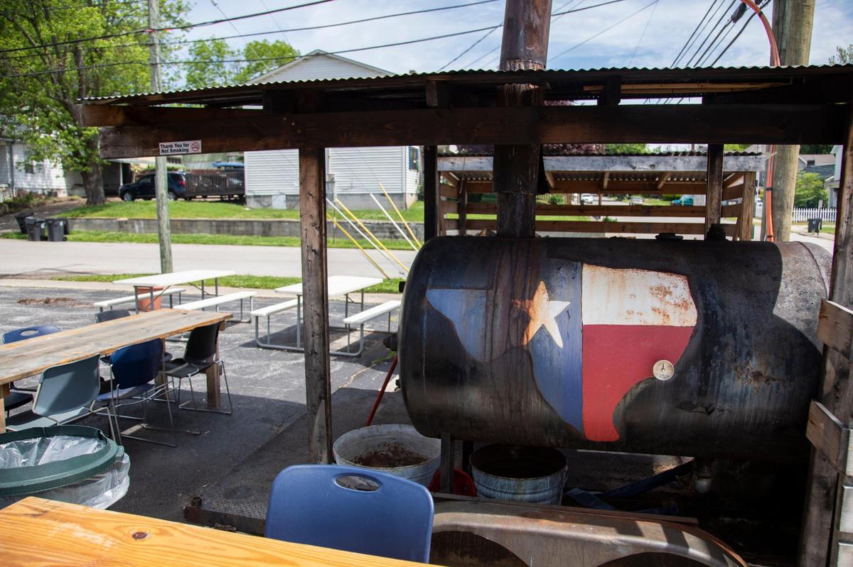 Owner Paul Morin’s smoker sits outside the shop at Straight from Texas Bar-B-Que in Richmond, Ky., Thursday, May 6, 2021. Morin was given the smoker by his father who thought he was going to need it one day.
