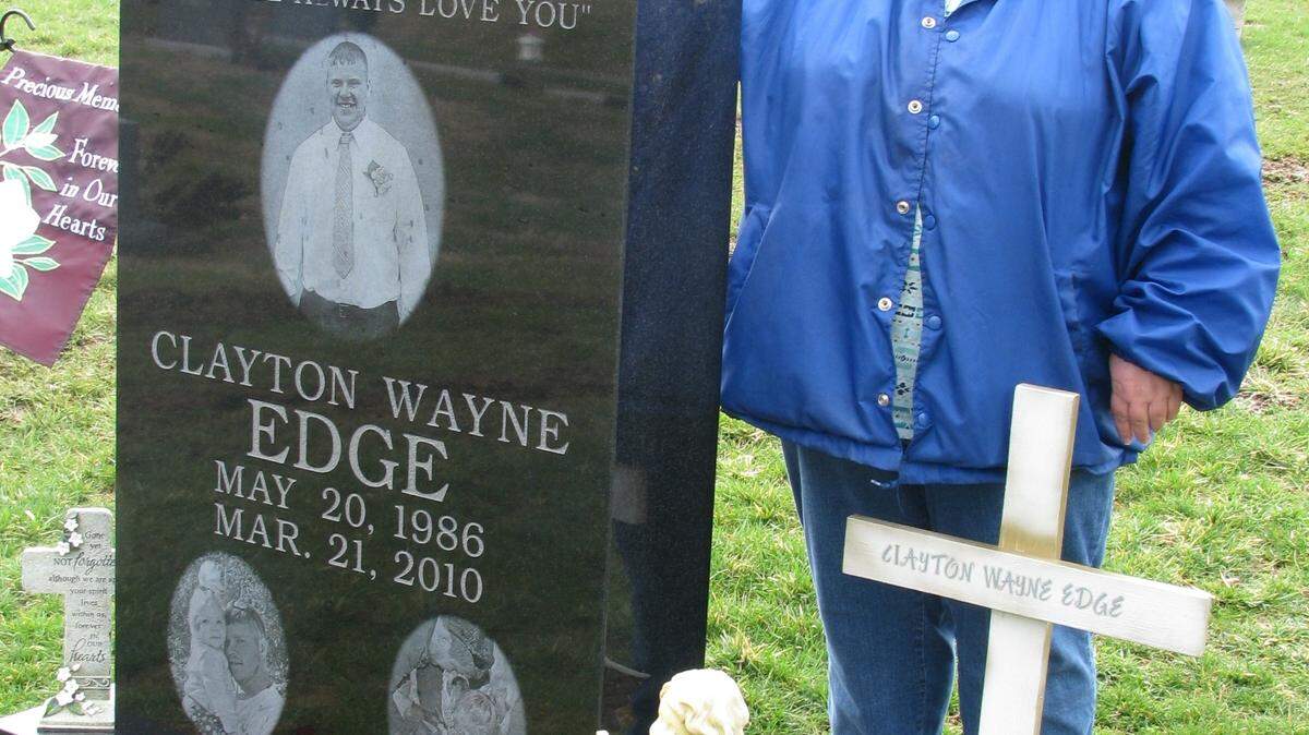 Gay Edge, the mother of Clayton Edge, visited his grave at Winchester Cemetery. Clayton Edge, 23, held a bonfire party at his home on Pine Ridge Road in the early morning hours on the day he and two others were killed.