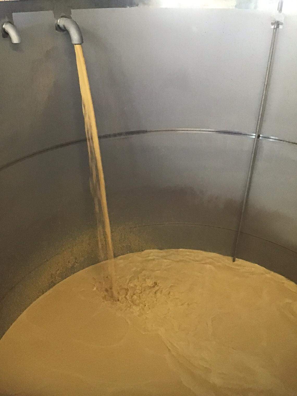 Cooked mash pours into a tank to ferment for six days, twice as long as many distilleries normally ferment their mash before distilling it to put into barrels at Potter Jane Distillery in Springfield. Jane Bowie and Denny Potter chose that process for the additional flavor.