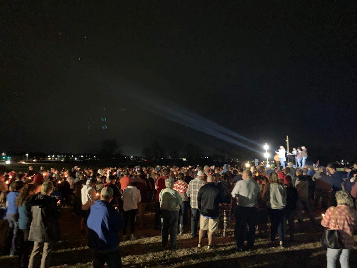More than 300 people showed up at the Mayfield candlelight vigil. Some released balloons at the event’s close.