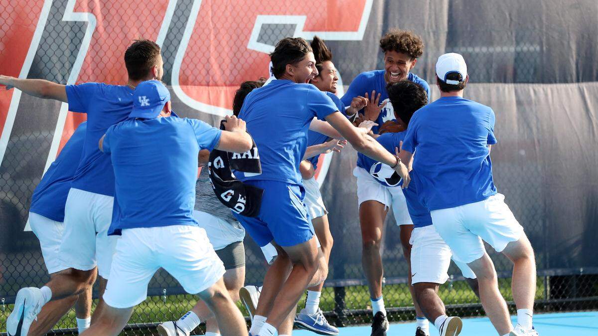 The Kentucky men’s tennis team celebrates after defeating TCU on Thursday in an NCAA Tournament quarterfinal at the Khan Outdoor Tennis Complex in Champaign, Illinois. With the victory, UK advanced to the NCAA Tournament semifinals for the first time in program history.