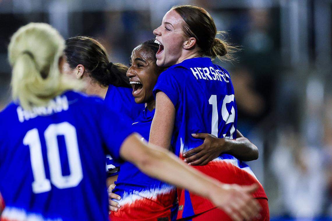 United States defender Naomi Girma, center, celebrates with teammates after scoring one of her two goals during a friendly victory over Argentina on Wednesday night in Louisville.