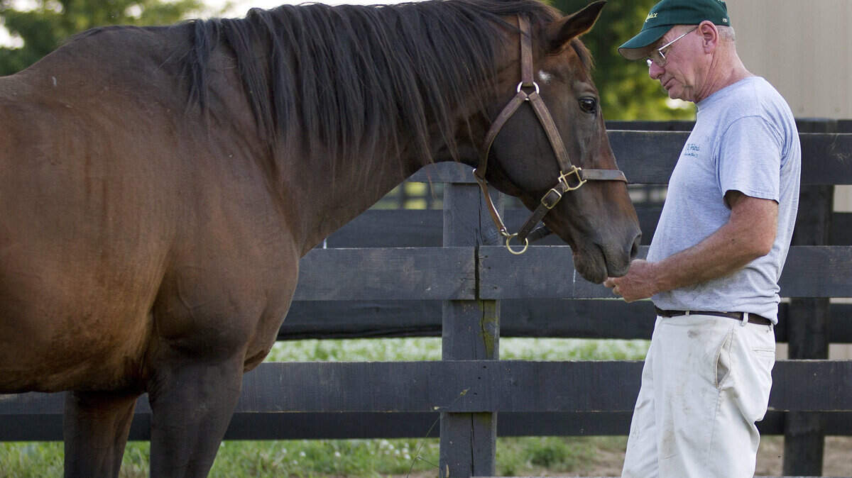 Michael Blowen of Old Friends Farm with Sunshine Forever on June 21, 2014. (Photo by Barbara D. Livingston)