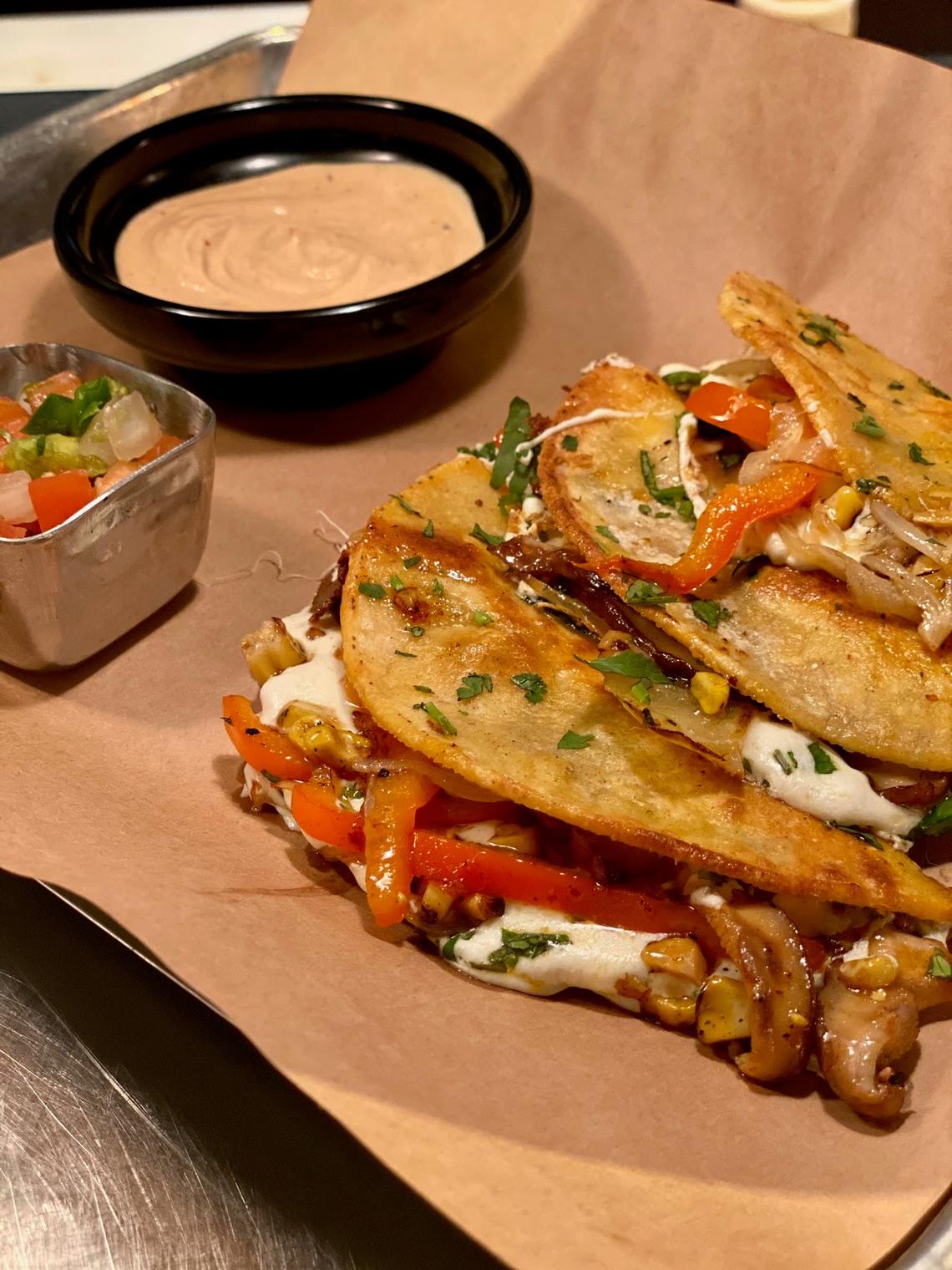 Agave & Rye’s vegetarian Verduras tacos are made with shiitake mushrooms, fresh roasted corn, julienne red peppers & onions, Oaxaca cheese and come with a spicy chipotle dipping sauce.