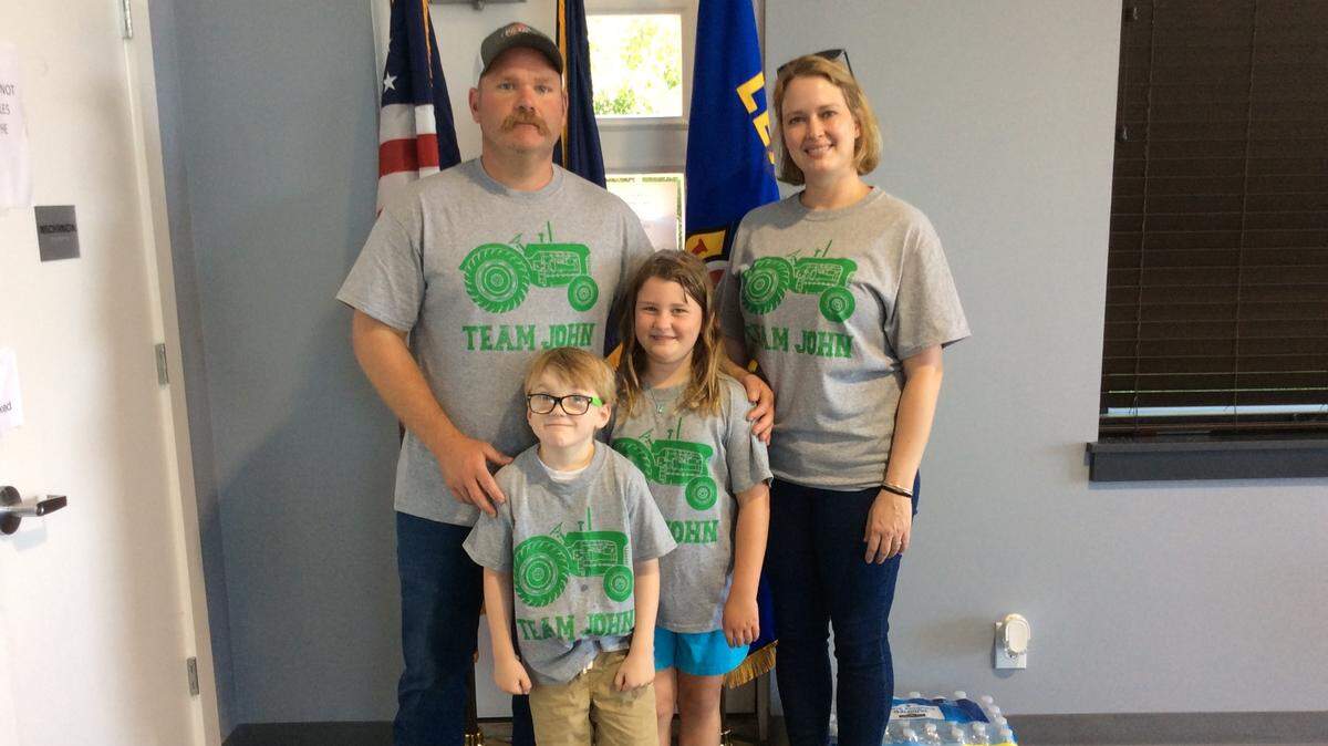 Joe, Katie, Roma and John Scott Sexton posed for a photo at a pancake breakfast Saturday morning at the Lexington Professional Firefighters union hall.