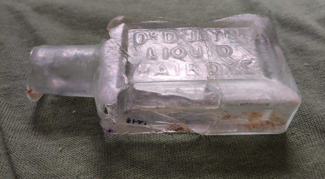 Dr Jaynes Hair Dye, one of the many bottles found at the site in Camp Nelson. The bottles were originally thought to be medicinal but research determined they were actually used for dye to darken hair, likely for photos.