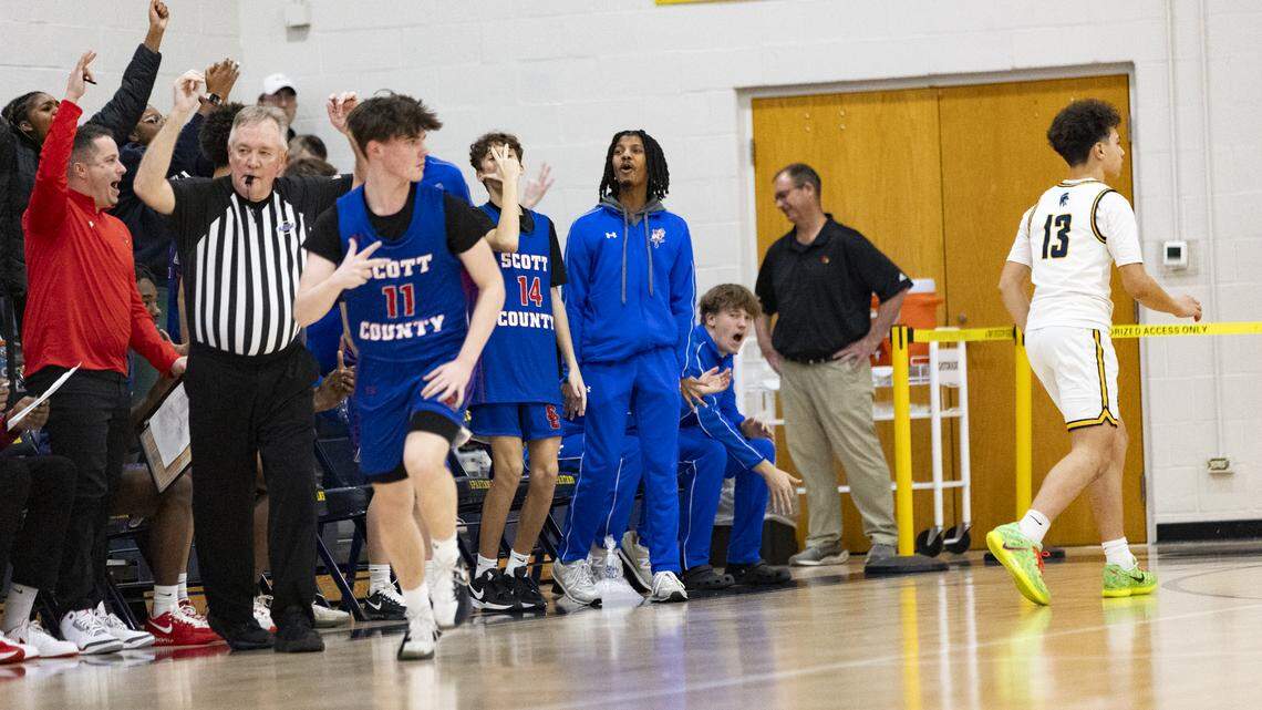 Scott County’s Parker Sanders celebrated his third consecutive 3-pointer during the second half of the Cardinals’ 70-39 win at Sayre on Tuesday.
