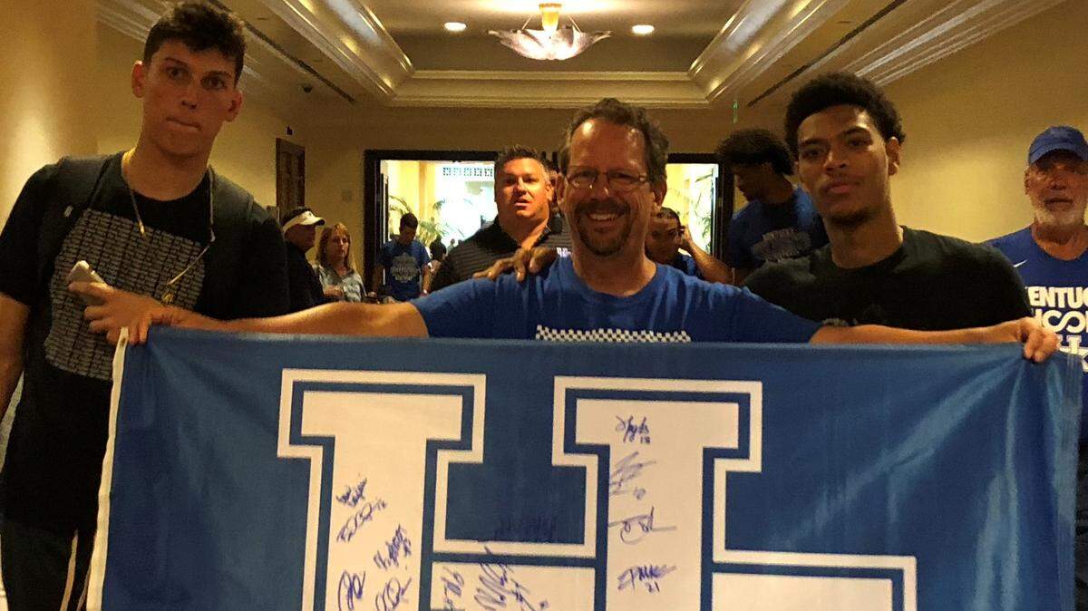 Kentucky fan Tony Thomas, center with Tyler Herro, left, and Quade Green, right, traveled to the Bahamas to watch the Cats play in 2018.