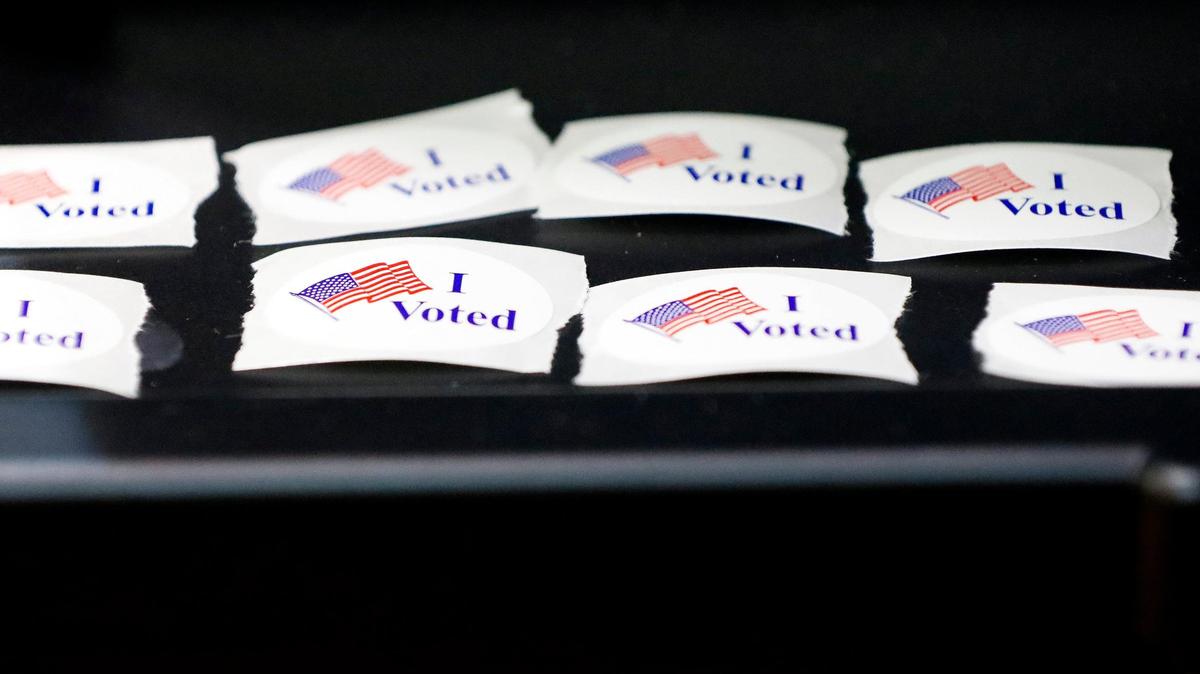 “I voted” stickers sit at a polling station at the Warfield Place precinct at Yates Elementary School, Tuesday, November 7, 2023 in Lexington, Ky.