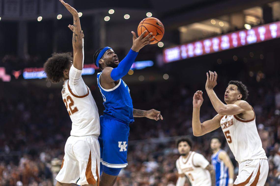 Kentucky’s Ansley Almonor (15) drives against Texas’ Devon Pryor (22) during Saturday’s game at the Moody Center in Austin, Texas. Almonor finished with 11 points.