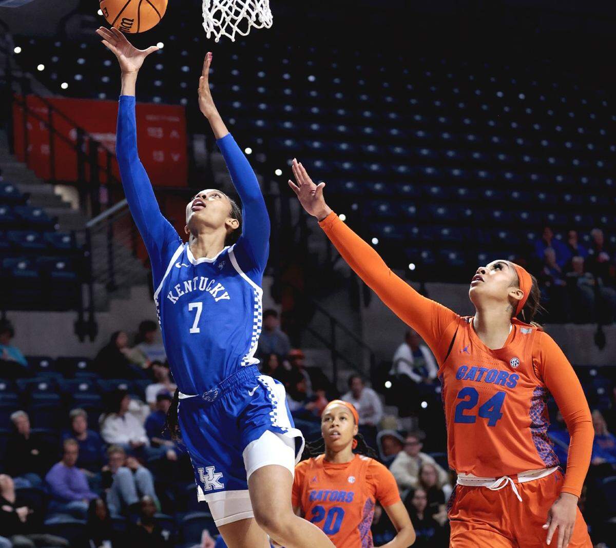 Teonni Key (7) drives past Florida’s Ra Shaya Karl for a layup during Thursday’s Kentucky win in Gainesville. Key finished with nine points and five rebounds.
