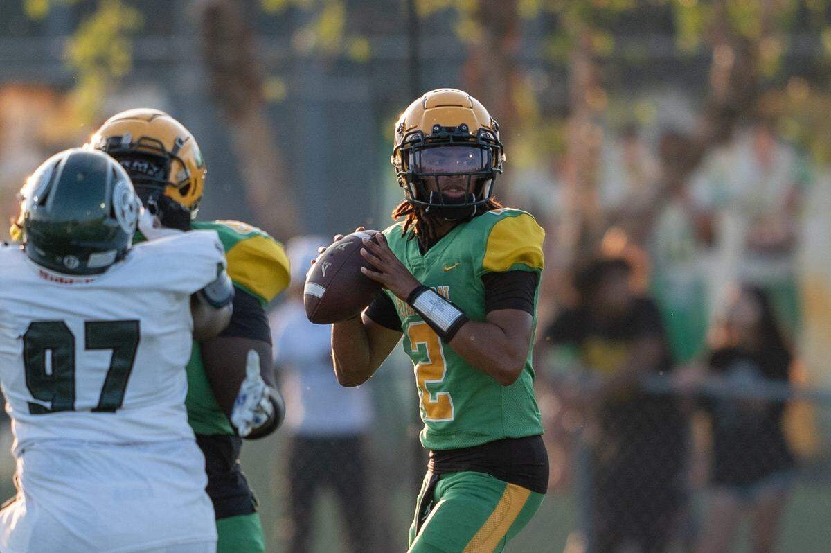 Bryan Station's James Davis (2) looks for an open pass during their game against Trinity on Friday, Aug. 23, 2024 at Bryan Station High School in Lexington, Ky.