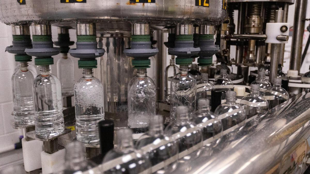 A machine fills plastic bottles with water at the Highbridge Springs underground bottling facility in Wilmore, June 2, 2022.