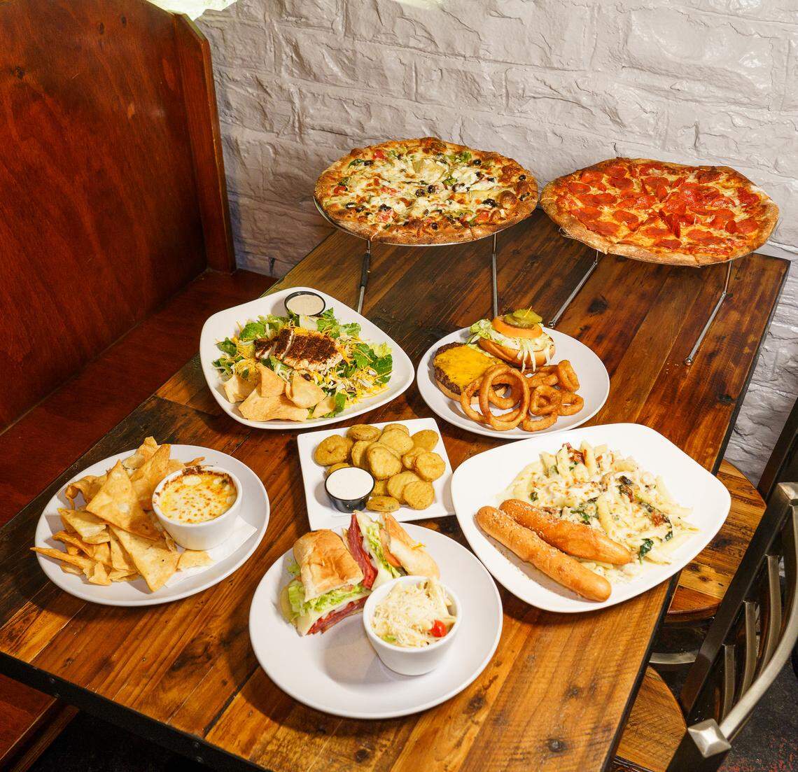 The Works Brick Oven Pizza has a menu of pizza, pasta, salad, sandwiches and more. Pizzas are cooked in a 700-degree brick oven.