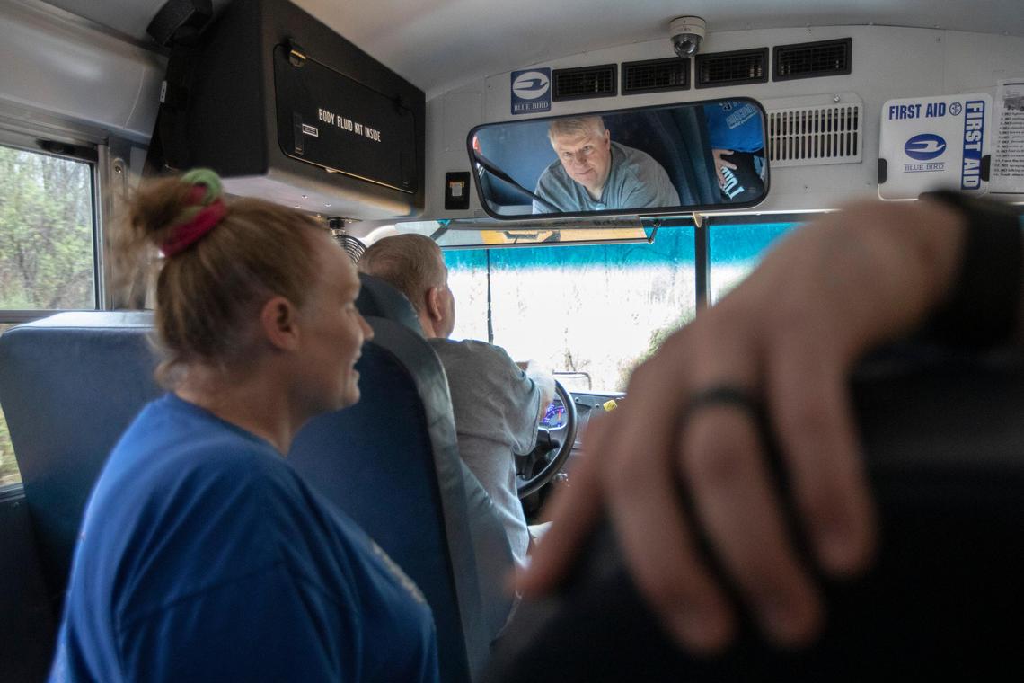 Gary Keathley, driving, Sherry Blakeman and Justin Brashear, not pictured, deliver snacks and school work to Betsy Layne Elementary School students in Floyd County, Ky., on Thursday, March 19, 2020.