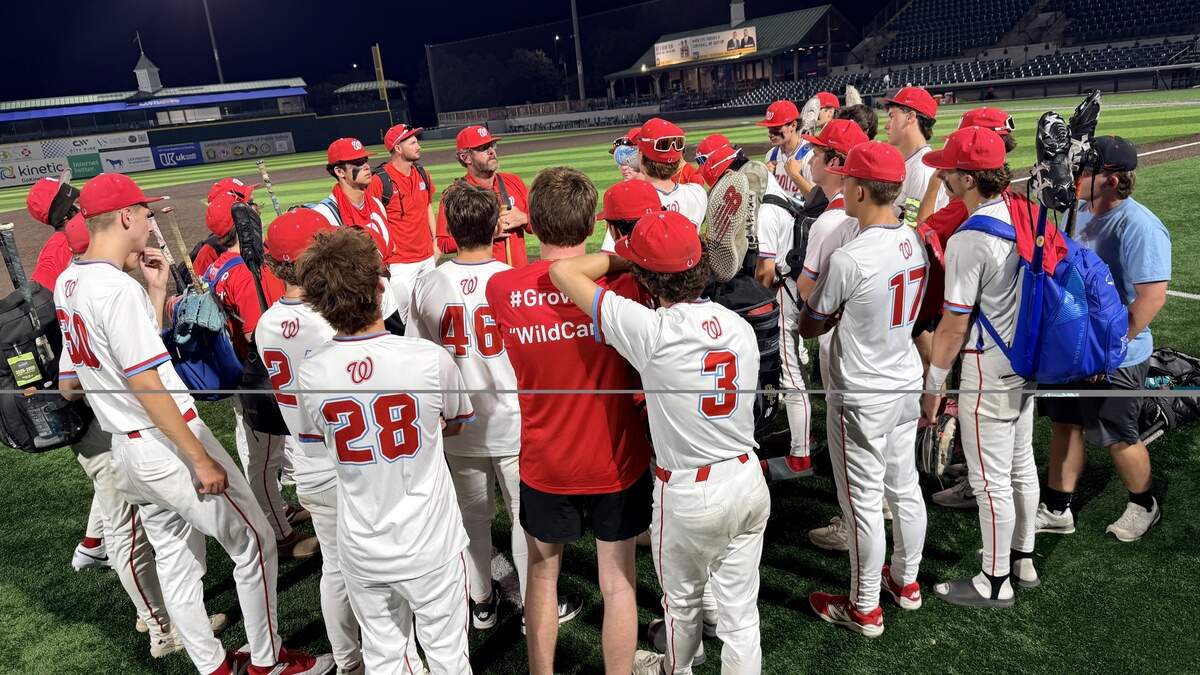 West Jessamine coach Austin Kearns, center, talks with his team after their 6-2 loss to Beechwood in the first round of the State Baseball Tournament presented by UK HealthCare at Legends Field on Friday. Photos available for purchase via Danny Vaughn Photography.