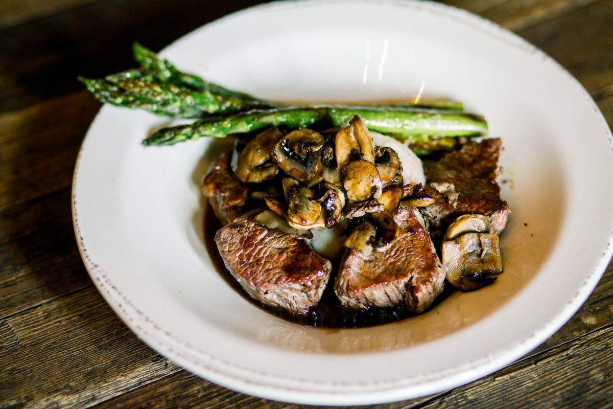 The Beef Tender Medallions at Nic & Norman’s for $26 is served with sautéed mushrooms, asparagus, mashed potatoes and a wine reduction.