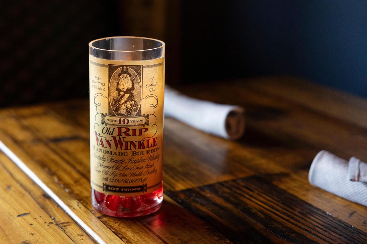 The Obstinate Sons has candle holders made from special bourbon bottles including Old Rip Van Winkle.