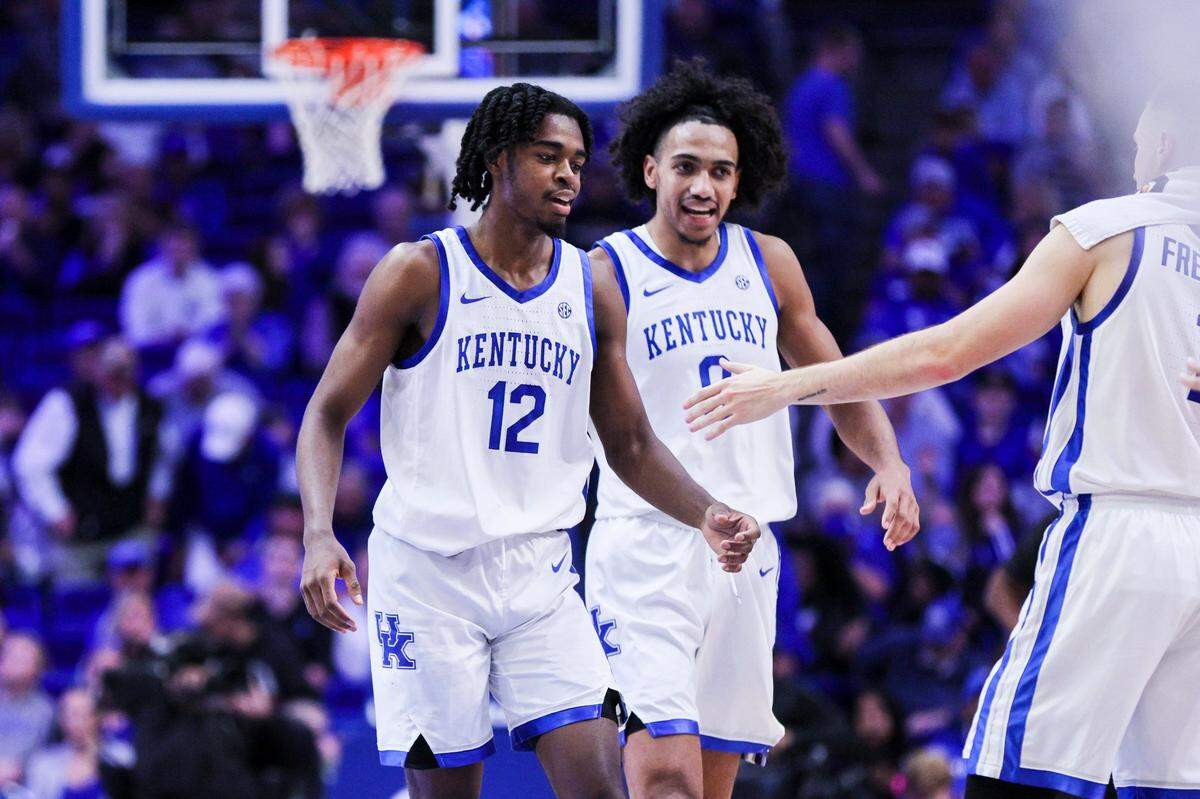 Kentucky guard Antonio Reeves, left, celebrates with teammates CJ Fredrick, right, and Jacob Toppin during the Cats’ victory over Howard in the season opener.