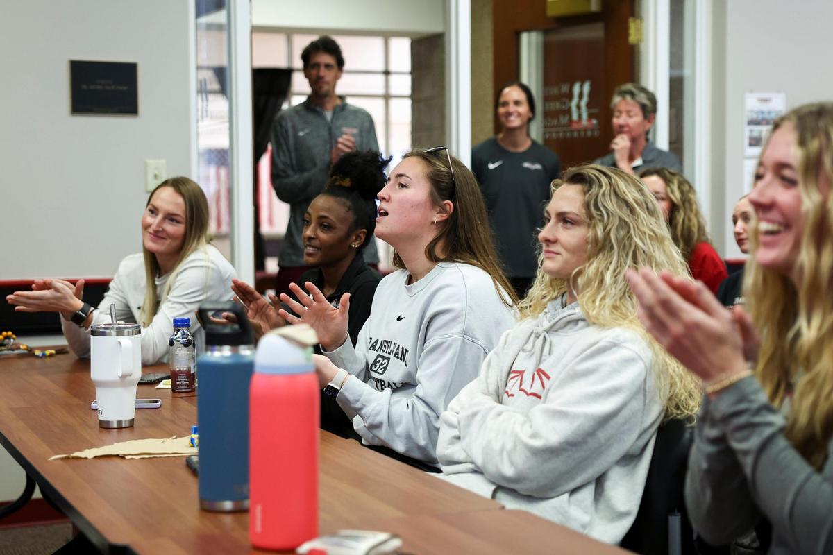 Transylvania seniors Sydney Wright, Dasia Thornton, Laken Ball and Kennedi Stacy react during the NCAA Division III Tournament selection show viewing party on Monday at the Clive M. Beck Center.