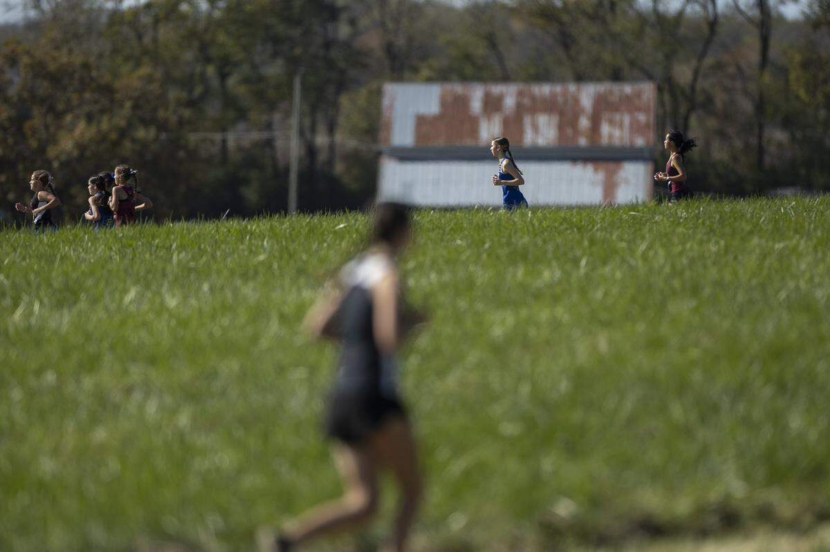 Runners compete in the 2025 KHSAA Class 2A State Cross Country Meet at the Kentucky Horse Park in Lexington on Saturday, Nov. 1, 2025.