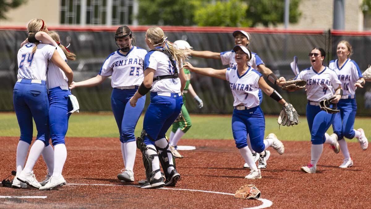 Madison Central’s players celebrate after securing the final out of their 4-0 win over Bryan Station in the 11th Region Softball Tournament championship game at George Rogers Clark High School in Winchester on Saturday.