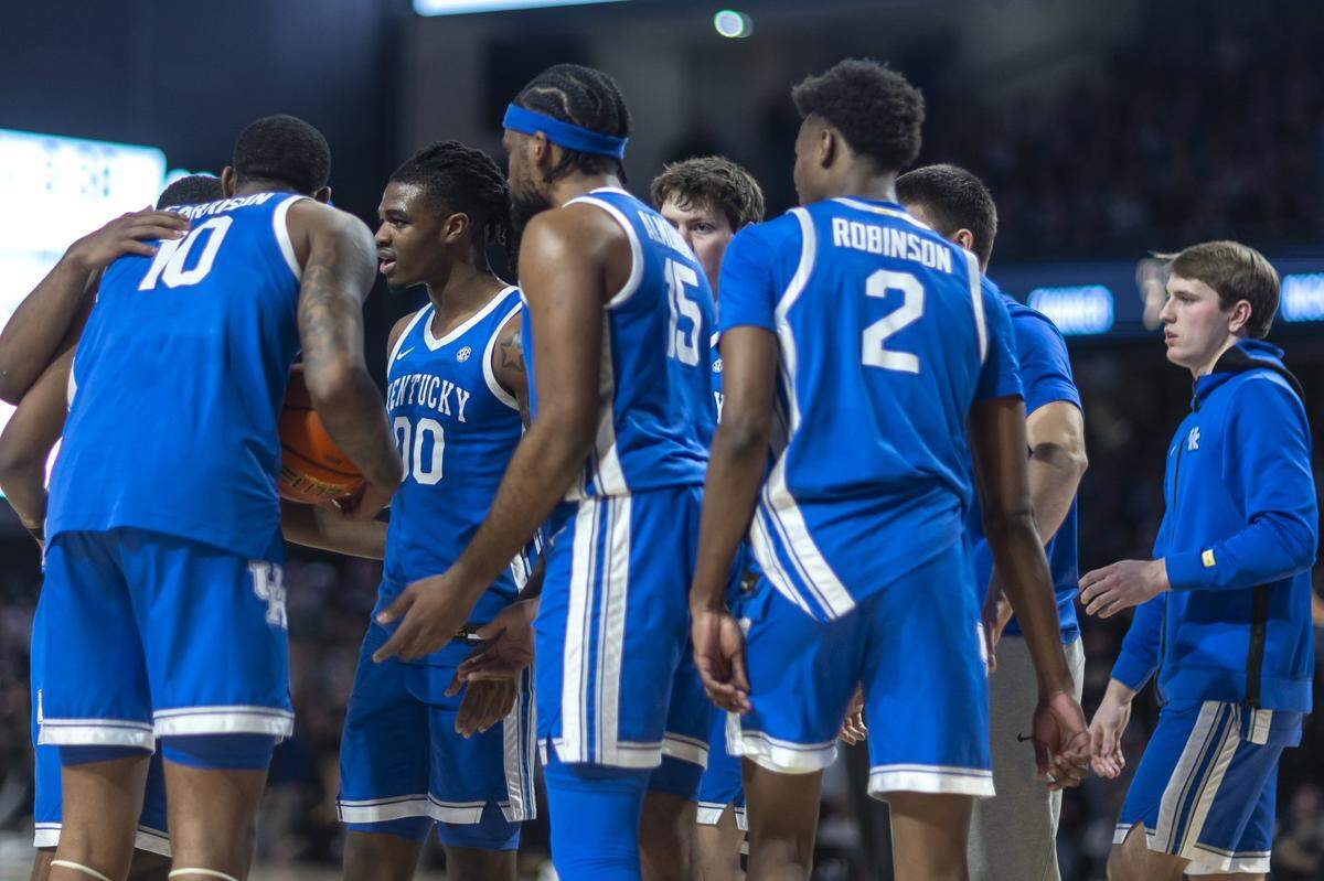 Kentucky players talk during a timeout in Saturday’s game against Vanderbilt at Memorial Gymnasium in Nashville, Tennessee.