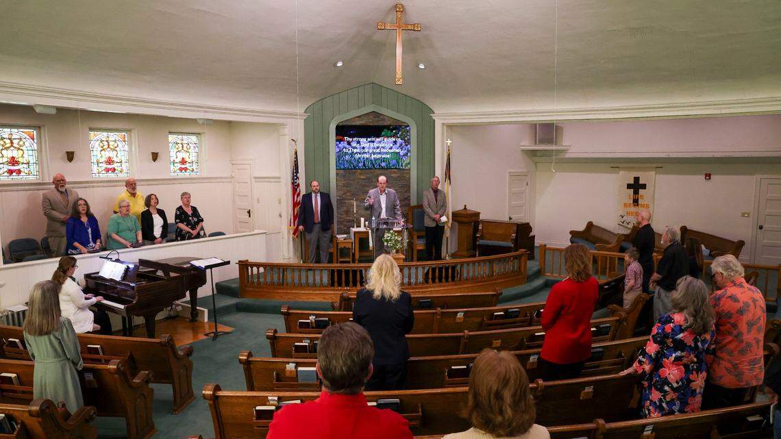 The congregation of First United Methodist Church in downtown London, Ky. holds services, Sunday, May 18, 2025. Two days earlier, a deadly tornado ripped through the Southern Kentucky city destroying many homes.