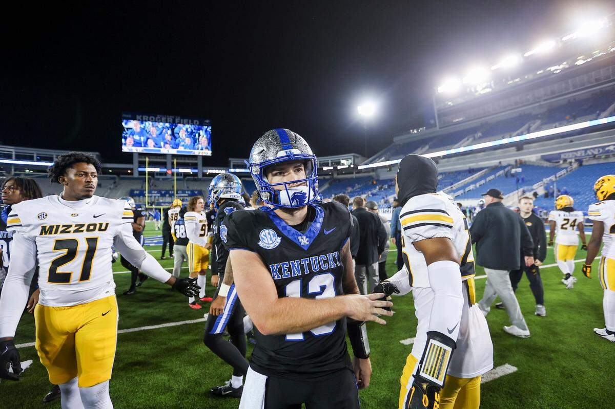 Kentucky quarterback Devin Leary (13) walks off the field after his team’s loss to Missouri at Kroger Field. Leary threw a pair of interceptions to go with two TD passes and a scoring run.