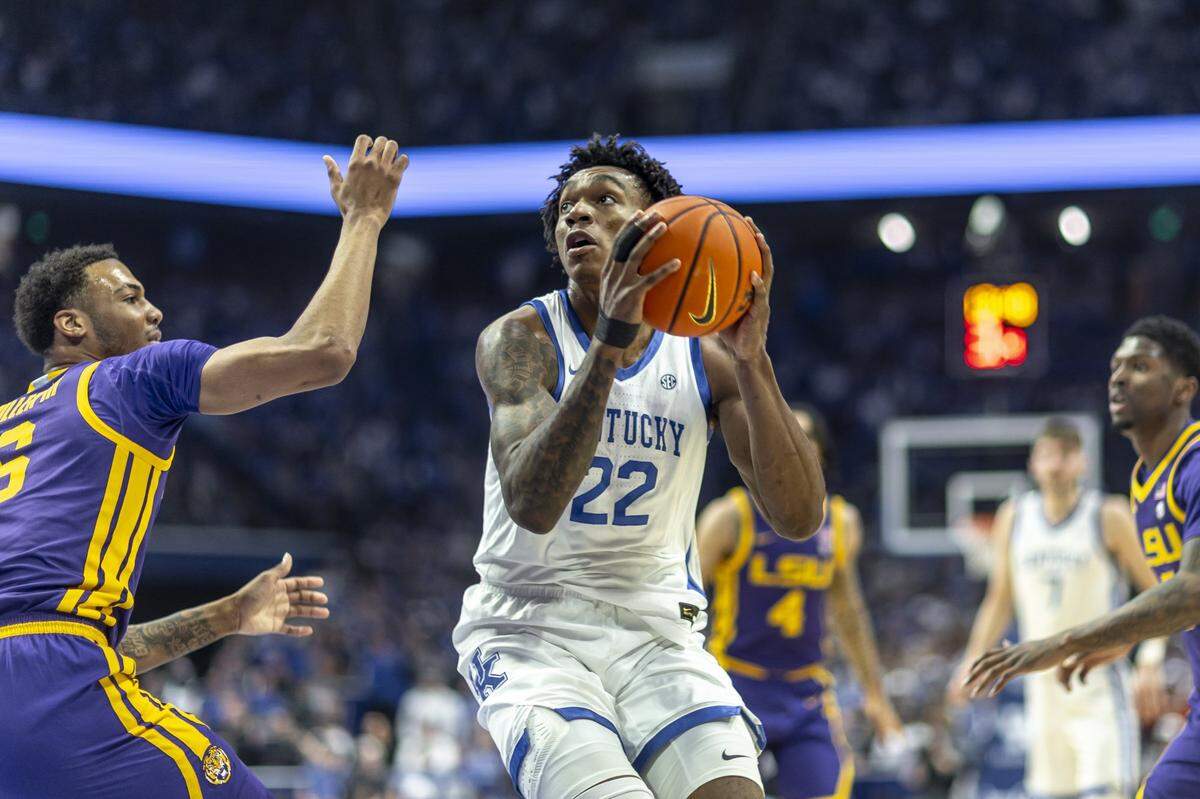 Kentucky center Amari Williams (22) looks to shoot while guarded by LSU’s Robert Miller III (6) during Tuesday’s game in Rupp Arena.