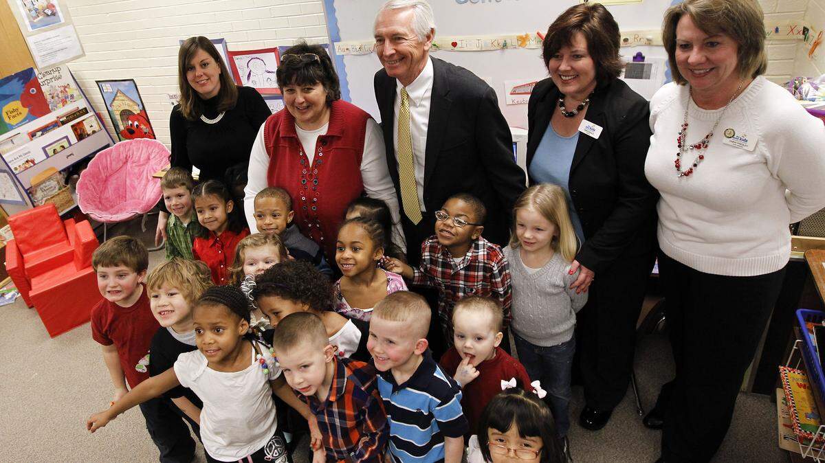 Gov. Steve Beshear had his photo taken with students and faculty afte he discussed his early childhood education initiatives and proposed expansion of preschool eligibility, at a morning news conference held in Lisa Mudd's preschool class at Dixie Magnet Elementary School, 1940 Eastland Parkway., in Lexington, Ky., Thursday, February 16, 2012. Nearly 40 children are enrolled in Dixie Magnet ElementaryÕs preschool program. Back row L-R: Paraeducator Tara Carter, Teacher Lisa Mudd, Gov. Steve Beshear, Principal Tara Isaacs, Assistant Principal Cheri Presley, Charles Bertram | Staff