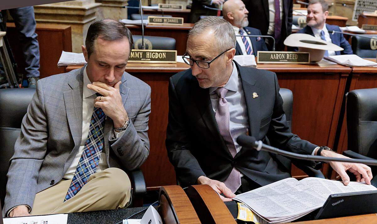 Sen. Christian McDaniel, R-Ryland Heights, listens as Senate President Pro Tempore David P. Givens, R-Greensburg, confers with him on the Senate floor in 2025.