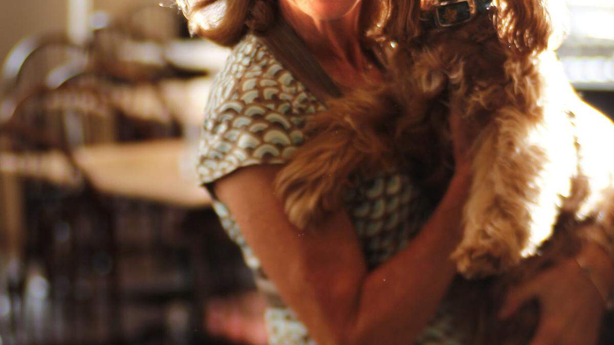Dudley's Restaurant owner Debbie Long and her dog Lucille, on Thursday August 17, 2012  in Lexington, Kentucky.  Photo by Mark Cornelison | Staff  