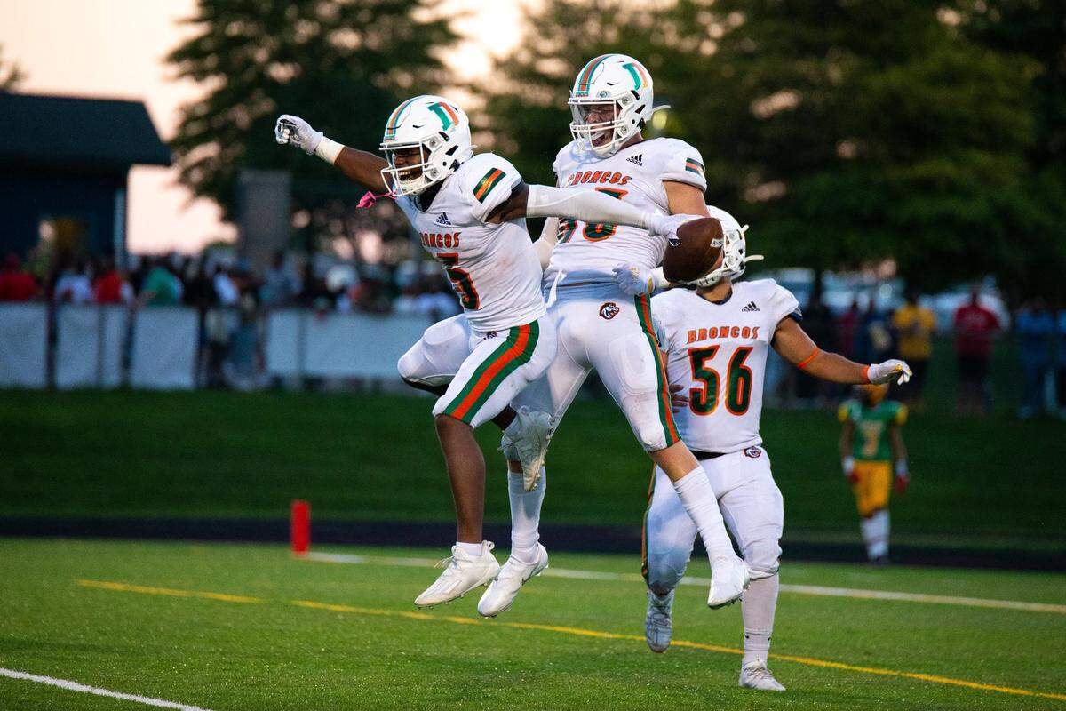 Frederick Douglass running back TJ Horton (15) celebrated a touchdown with Thomas Howard (83) during Friday’s win against Bryan Station.