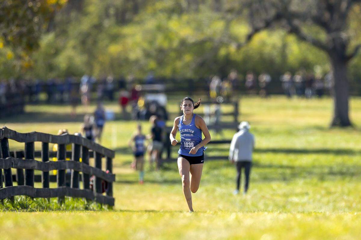 Lexington Catholic’s Anna Dawahare runs during the Class 2A girls state cross country meet at the Kentucky Horse Park on Saturday. The Knights won the team title.