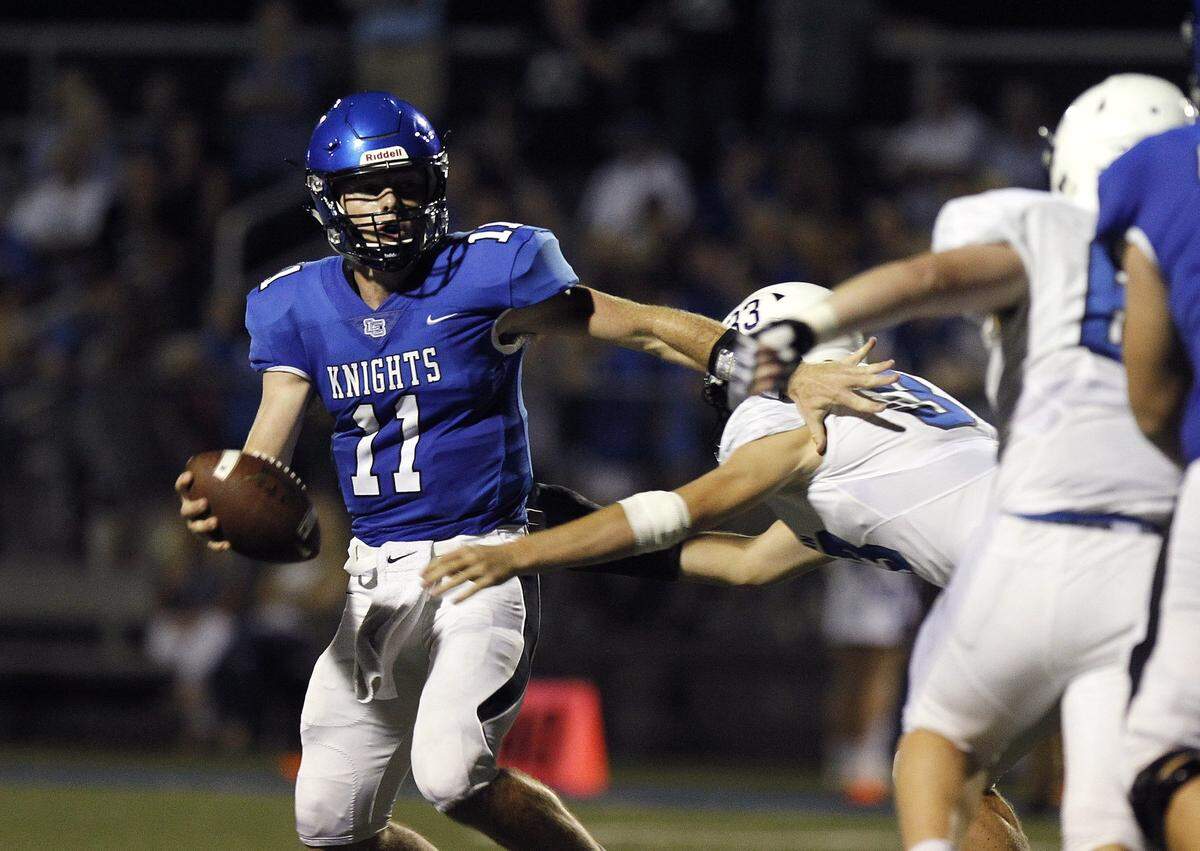 Lexington Catholic junior quarterback Beau Allen (11) holds scholarship offers from Kentucky, Michigan, Washington State, Maryland, Duke and Cincinnati, among others.