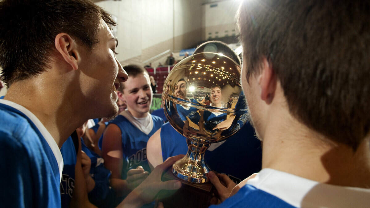 Betsy Layne's Tanner Martin, left, and Derek Tackett admired their reflections in the championship trophy.  
