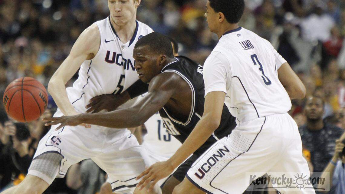 Butler guard Shelvin Mack (1) fought through Connecticut forward Niels Giffey (5) and Connecticut forward Jeremy Lamb (3) in the first half of a men's NCAA Final Four championship college basketball game Monday April 4, 2011, in Houston. Photo by David Perry | Staff
